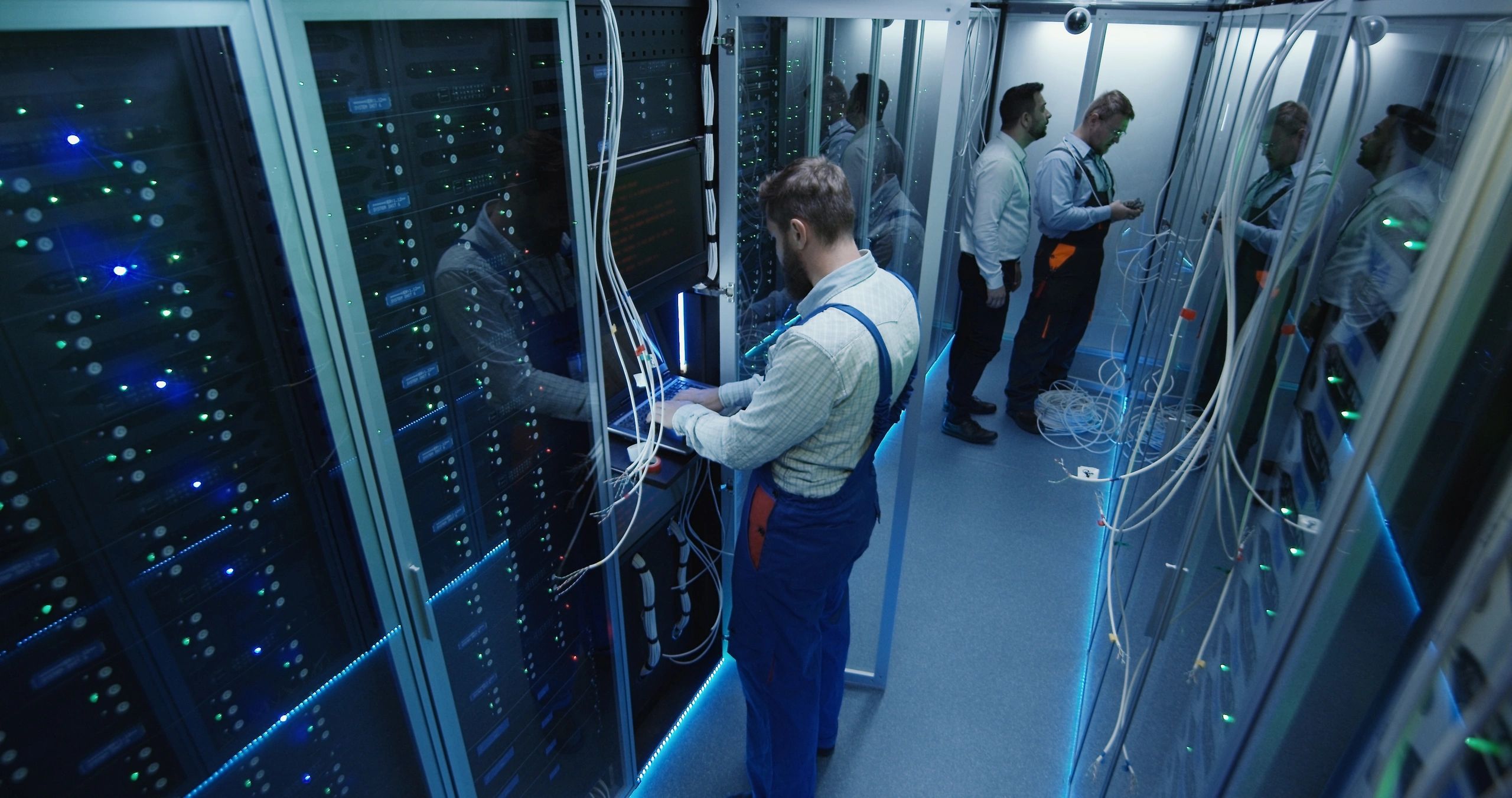 Technicians working in a telecommunications data center