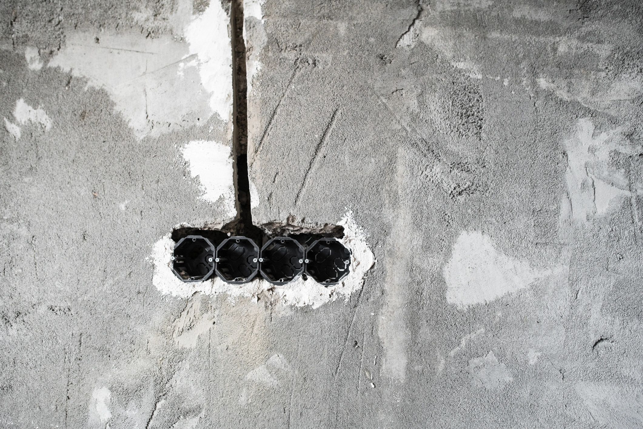 Electrical wiring and box connector on wall for mounting a switch and sockets