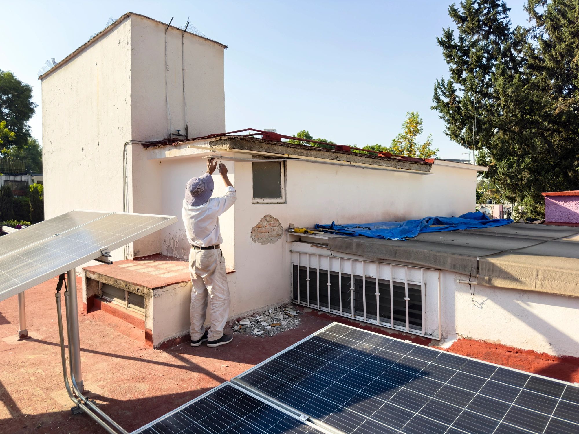 Electrical contractor working on a rooftop installation