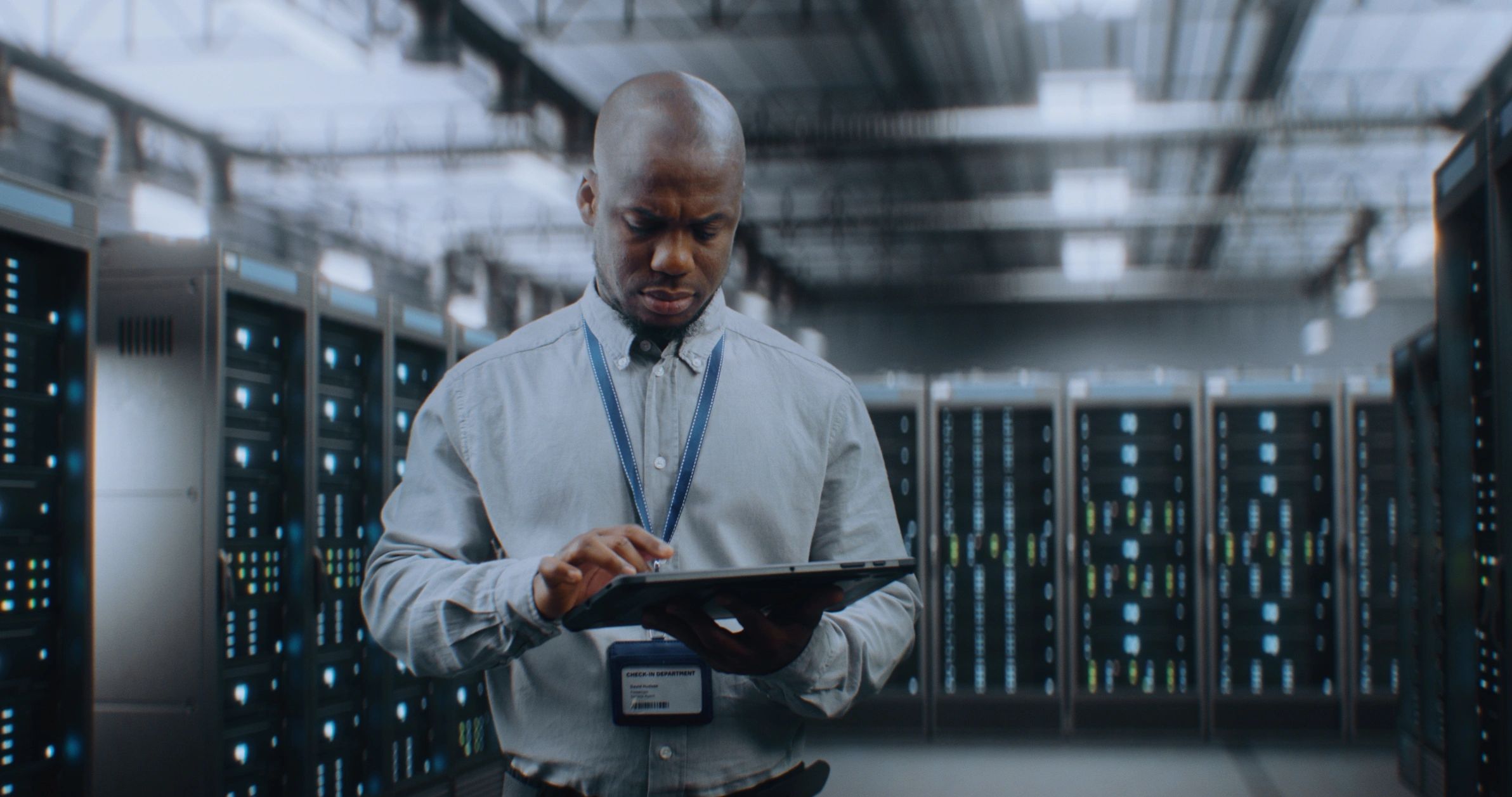 Building automation specialist using a tablet in a data center