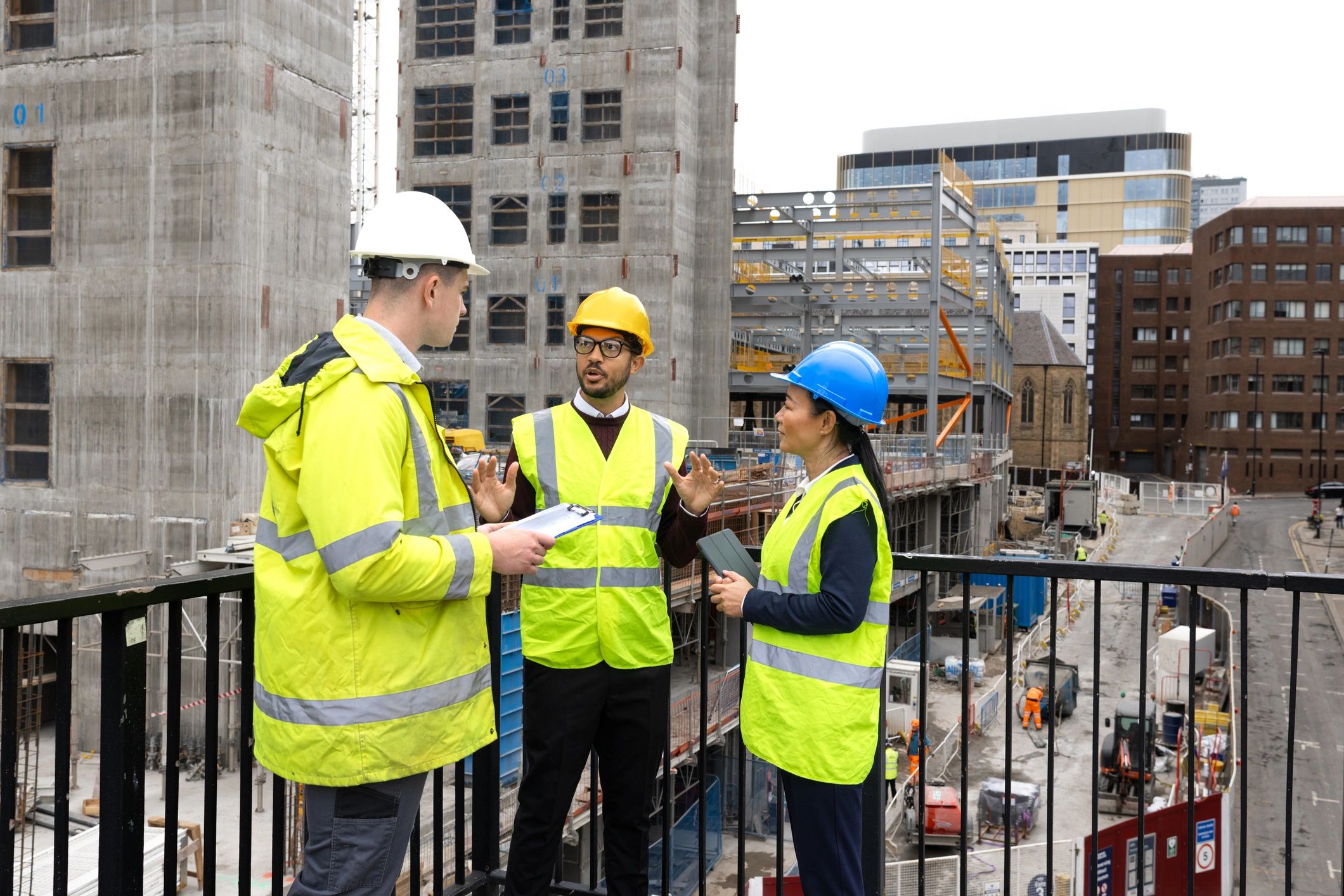 Electrical contractor team reviewing plans on site